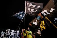 Hong Kong anti-government protesters attend a rally in support of Taiwan President Tsai Ing-wen outside the Democratic Progressive Party (DPP) headquarters in Taipei