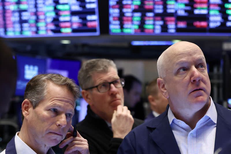 Traders work on the trading floor at the New York Stock Exchange (NYSE) in New York City