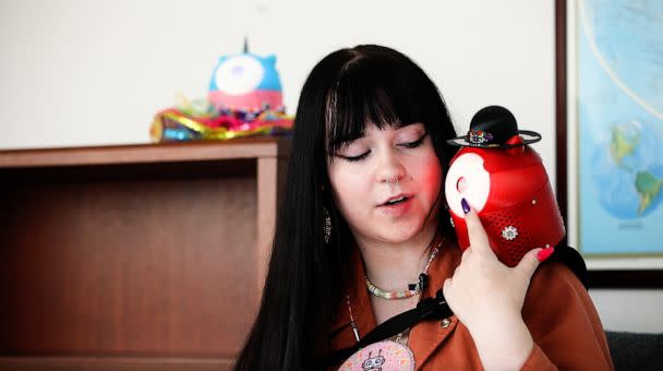 PHOTO: Danielle Boyer demonstrates how her invention the SkoBot, which teaches children Indigenous languages, works. (ABC News)