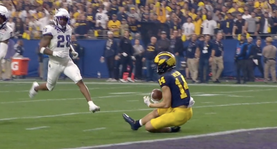 Was Michigan's Roman Wilson short of the goal line when he secured this catch? (via ESPN)