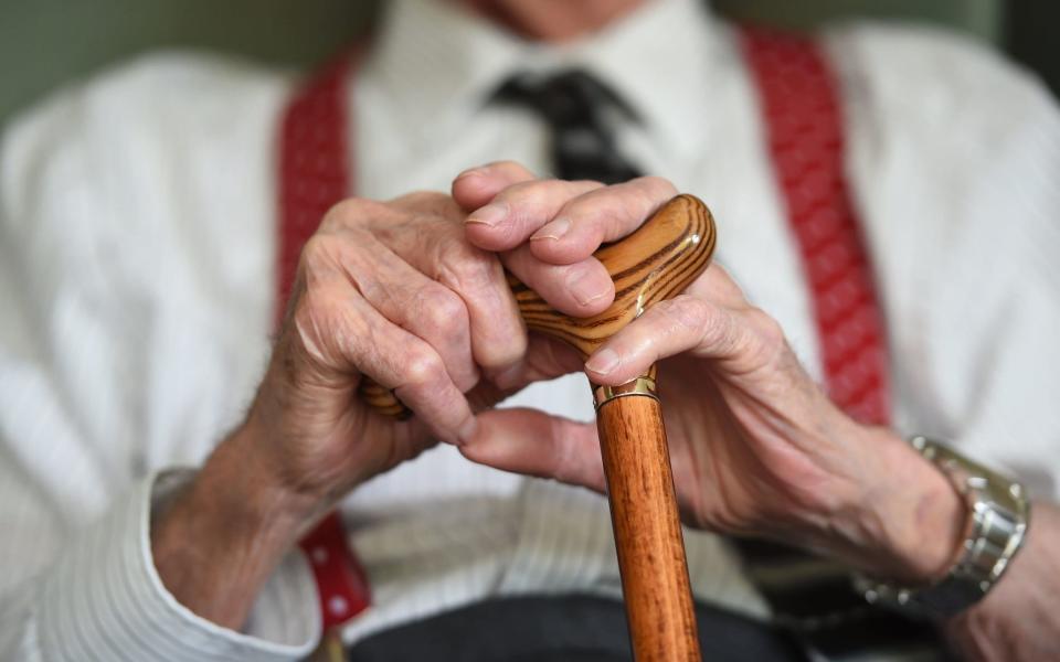 Pensioner with walking stick state pension age - Joe Giddens/PA