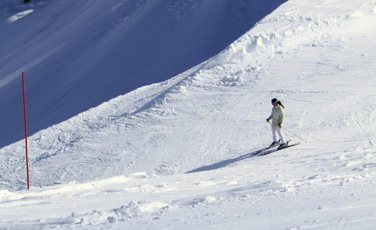 A skier at Palisades Tahoe, home of the 1960 Winter Olympics and site of a small but deadly avalanche in 2024. <a href="https://newsroom.ap.org/detail/SnowboundSierra/fa093ab6ef4849ad990f949d64a2887a/photo" rel="nofollow noopener" target="_blank" data-ylk="slk:AP Photo/Rich Pedroncelli;elm:context_link;itc:0;sec:content-canvas" class="link ">AP Photo/Rich Pedroncelli</a>