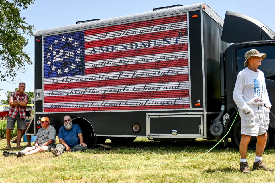 A truck displays the Second Amendment on a video screen during the 'Defend our 2A: Michigan's Right for Self Preservation' event on Wednesday, July 19, 2023, at Freedom Farms in Ionia Township.