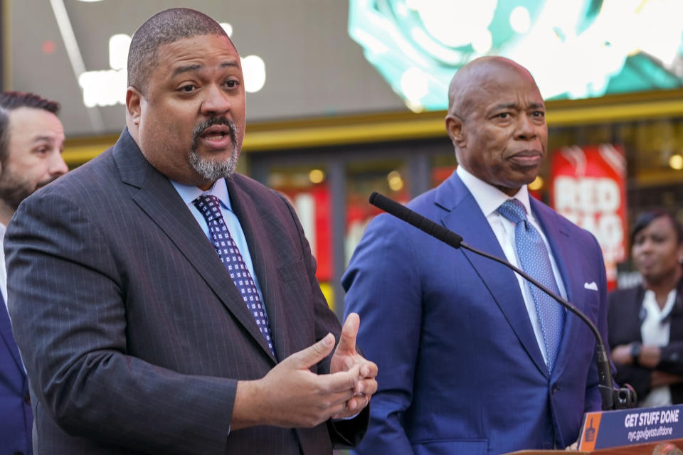 FILE — Manhattan District Attorney Alvin Bragg, left, and New York City Mayor Eric Adams, speak at a News conference in New York's Times Square, Oct. 11, 2022. Bragg has announced an indictment of several people who allegedly participated in a straw donor scheme to raise money for Adams, Friday, July 7, 2023. (AP Photo/Mary Altaffer, File)