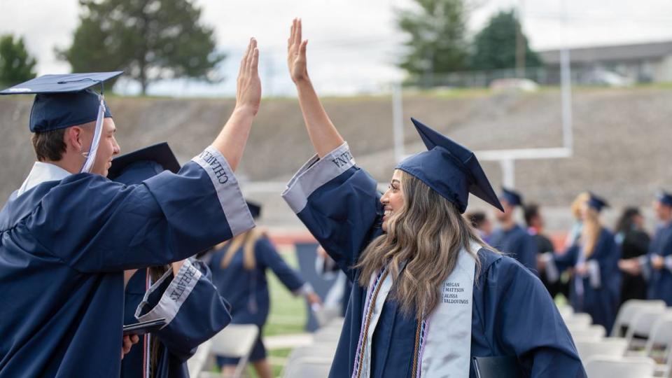 Family and friends fill Edgar Brown Stadium on June 11 to watch 525 Chiawana High School graduates receive their diplomas during the school’s outdoor commencement ceremony in Pasco.