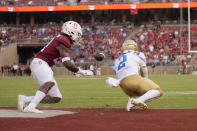 UCLA wide receiver Kyle Philips (2) catches a pass for a touchdown in front of Stanford safety Kendall Williamson (21) during the second half of an NCAA college football game Saturday, Sept. 25, 2021, in Stanford, Calif. UCLA won 35-24. (AP Photo/Tony Avelar)