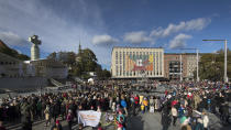 Faithful wait for Pope Francis' Mass in Freedom square in Tallinn, Estonia, Tuesday, Sept. 25, 2018. Pope Francis arrived in Estonia for a one-day visit Tuesday. (AP Photo/Mindaugas Kulbis)