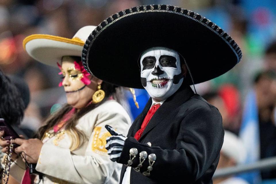 A fan cheers before an international friendly soccer match between Mexico and Ecuador in Charlotte, N.C., Wednesday, Oct. 27, 2021.