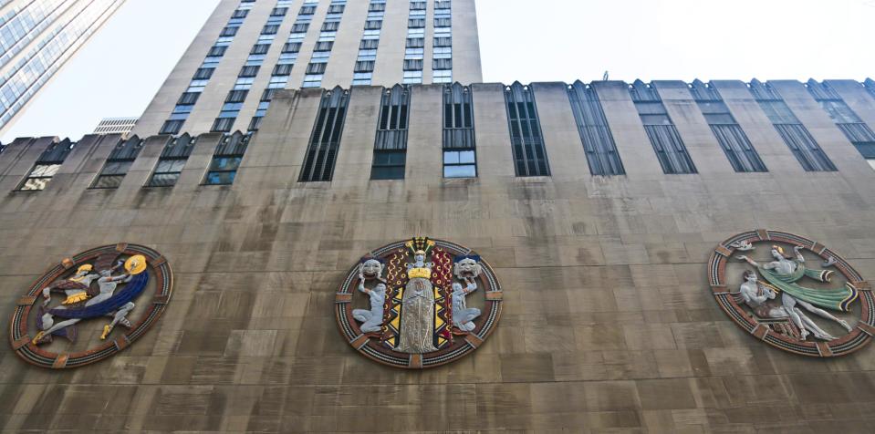 In this March 24, 2014 photo, three colossal metal-and-enamel roundels created by art deco muralist Hildreth Meiere stand out on the facade of Radio City Music Hall in New York. “The Art Deco Murals of Hildreth Meiere,” a new book on the trail-blazing muralist who completed over 100 commissions in 16 states before her death in 1961, is set for May 1. (AP Photo/Bebeto Matthews)