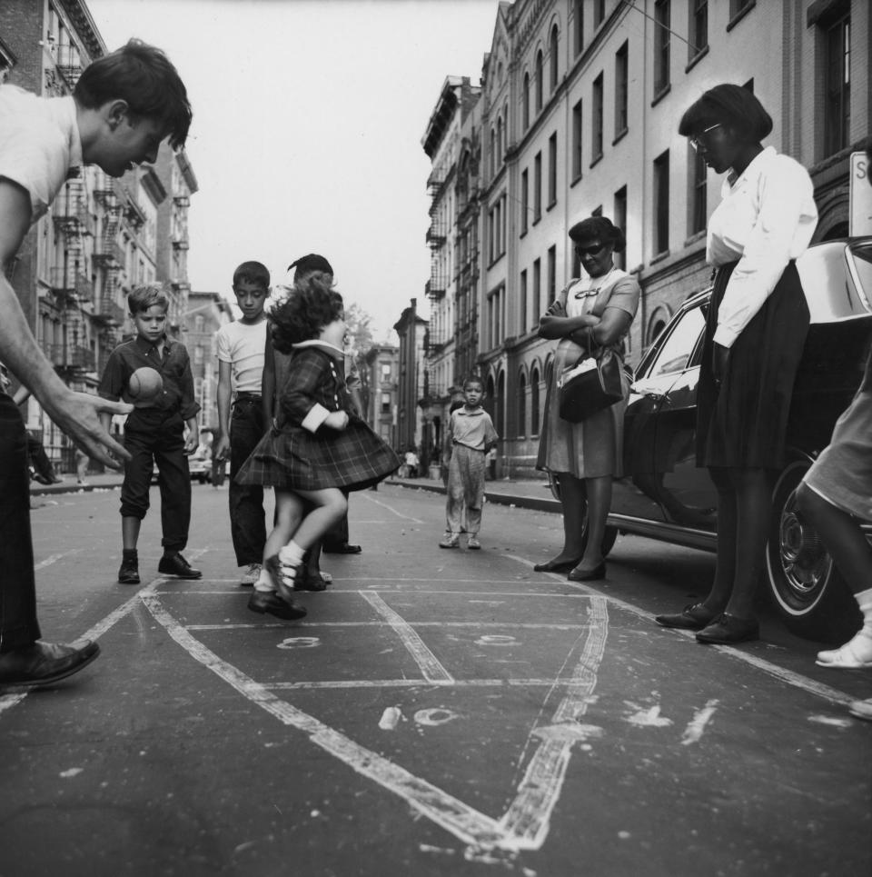 Circa 1965:  A view of children playing hopscotch in the street in Spanish Harlem (Photo by Hulton Archive/Getty Images)