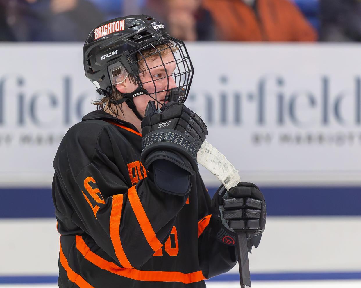 Brighton's Cam Duffany watches the celebration after a loss to Detroit Catholic Central in the state Division 1 championship hockey game Saturday, March 9, 2024.