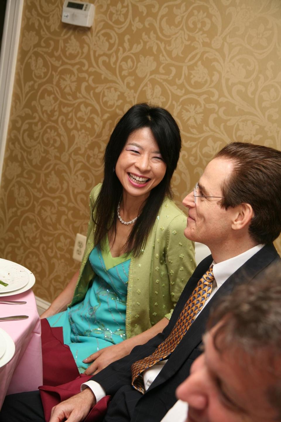 Yuko Love smiles at her husband, Dave, during a friend's wedding in 2009. Yuko lost her life when couple was swept away by the fatal flash floods in Upper Makefield on July 15, 2023.