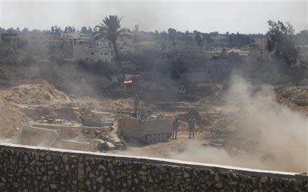 Egyptian soldiers keep guard on the border between Egypt and the southern Gaza Strip September 3, 2013. REUTERS/Ibraheem Abu Mustafa