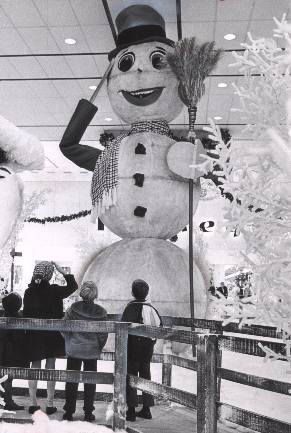 Talking snowman Archie Arctic greets young visitors at Chapel Hill Mall in December 1968, the year the 20-foot giant debuted.