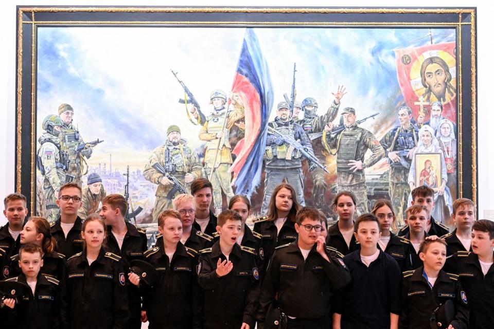 Cadets visit Russian patriotic artist Vasily Nesterenko's exhibition called "We are Russians, God is with us" in Moscow, Russia on May 23, 2023. (Kirill Kudryavtsev / AFP via Getty Images)