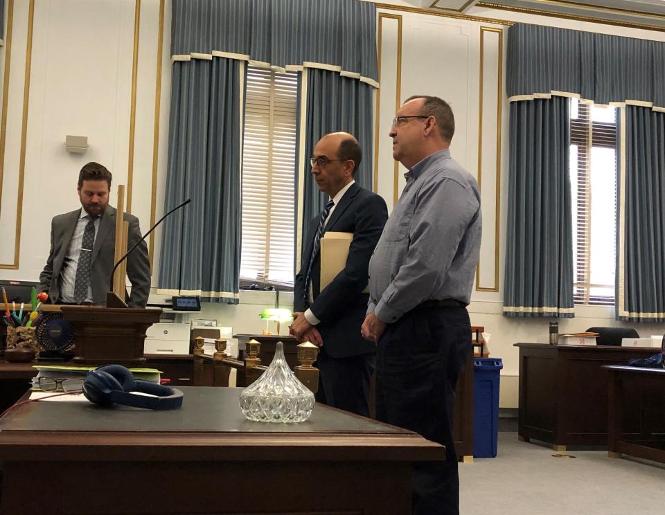 Leslie Shawn Brock, at right, stands before Judge Leslie Ghiz during his plea hearing in Hamilton County Common Pleas Court March 22. Brock's attorney, Edward Perry, is next to him.