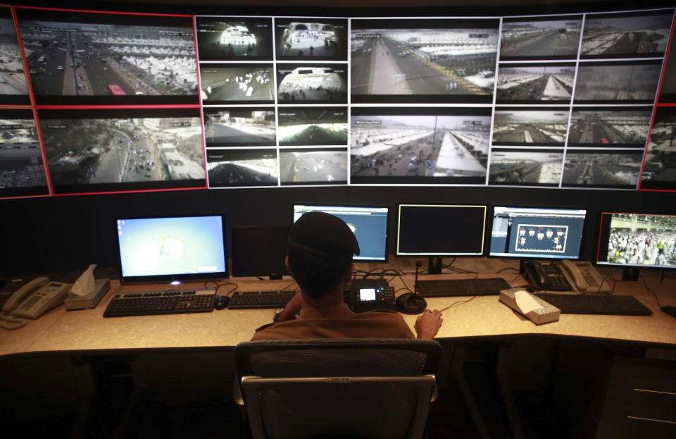 <p>Saudi security officers monitor live feed screens showing Muslim pilgrims in the holy city of Mecca, along with highways and high density areas, during hajj annual pilgrimage, in the holy city of Mecca, in Saudi Arabia. Saturday, Sept. 2, 2017. (Photo: Khalil Hamra/AP) </p>