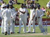 India’s Zaheer Khan, center, celebrates with teammates after dismissing New Zealand’s Kane Williamson for 7 on the third day of the second cricket test at Basin Reserve in Wellington, New Zealand, Sunday, Feb. 16, 2014.