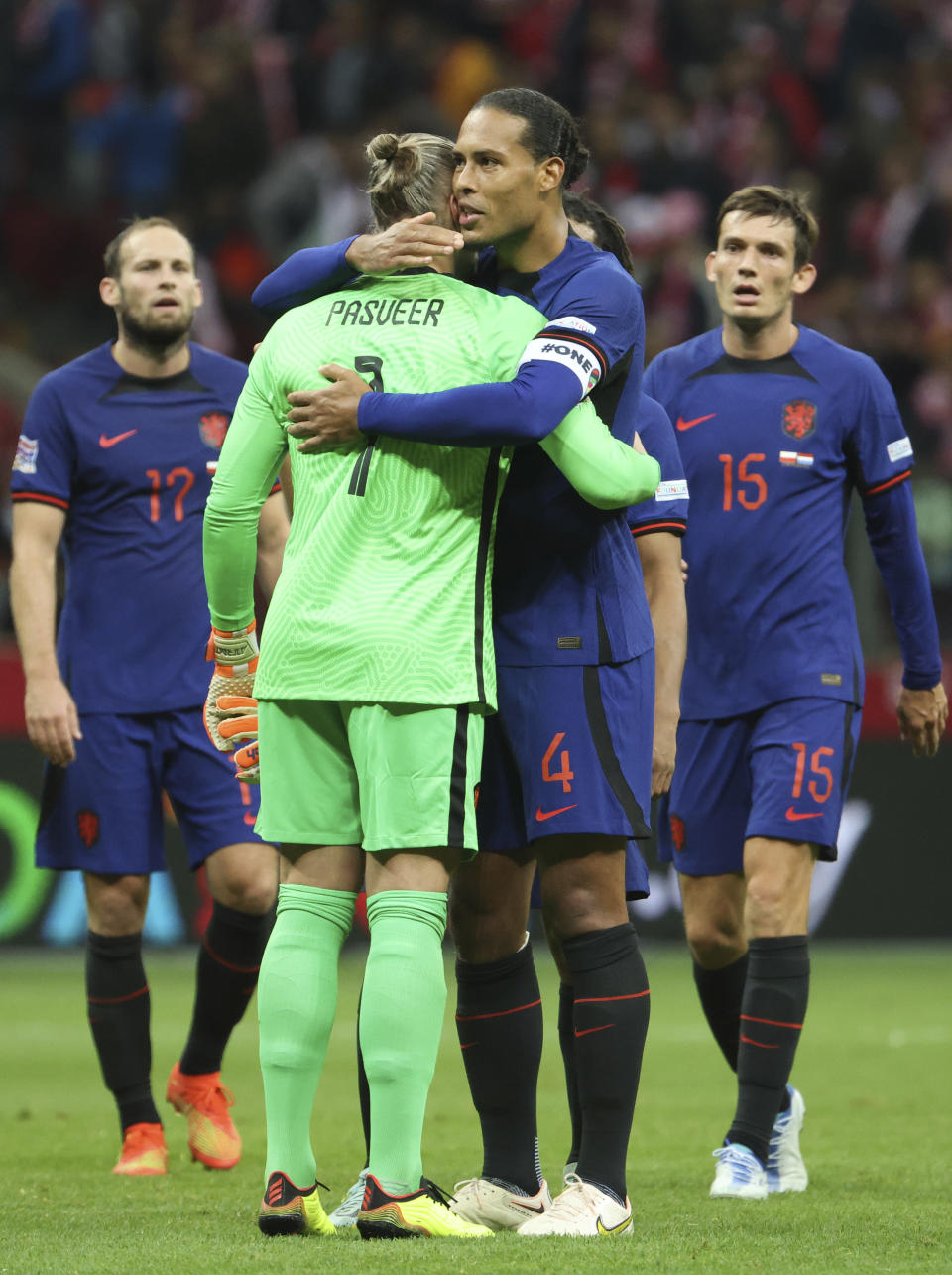 Netherlands' Virgil van Dijk cheers Netherlands' goalkeeper Remko Pasveer at the end of the UEFA Nations League soccer match between Poland and the Netherlands at the National Stadium in Warsaw, Poland, Thursday, Sept. 22, 2022. (AP Photo/Michal Dyjuk)