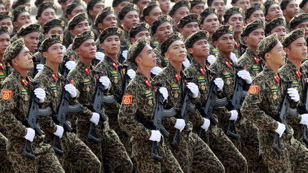 Soldiers hold Israeli-made Galil rifles while marching during a celebration to mark National Day at Ba Dinh square in Hanoi September 2, 2015. Photo taken September 2, 2015. REUTERS/Kham -