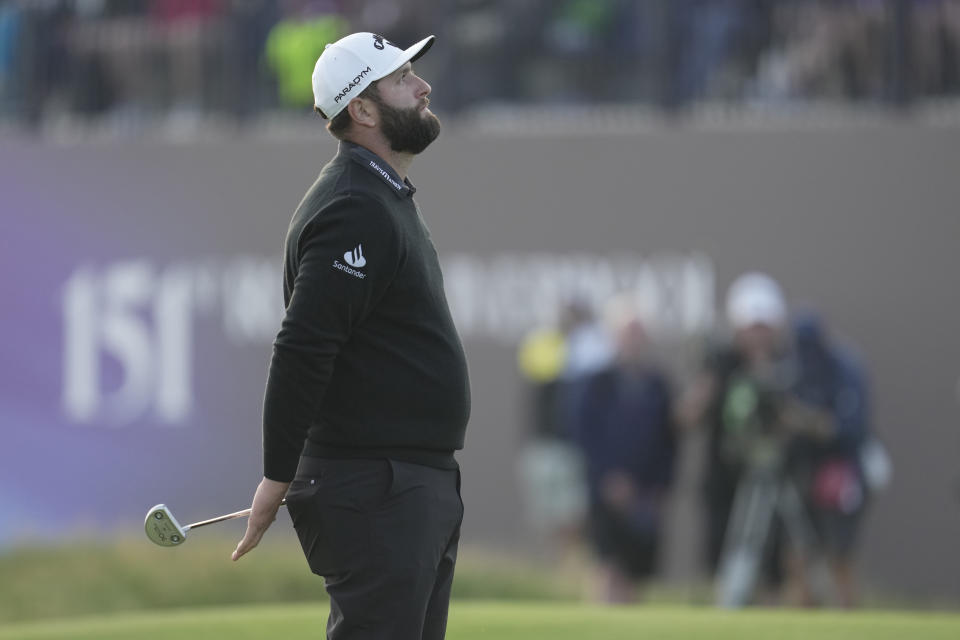 Spain's Jon Rahm waits to putt on the 18th green on the first day of the British Open Golf Championships at the Royal Liverpool Golf Club in Hoylake, England, Thursday, July 20, 2023. (AP Photo/Kin Cheung)