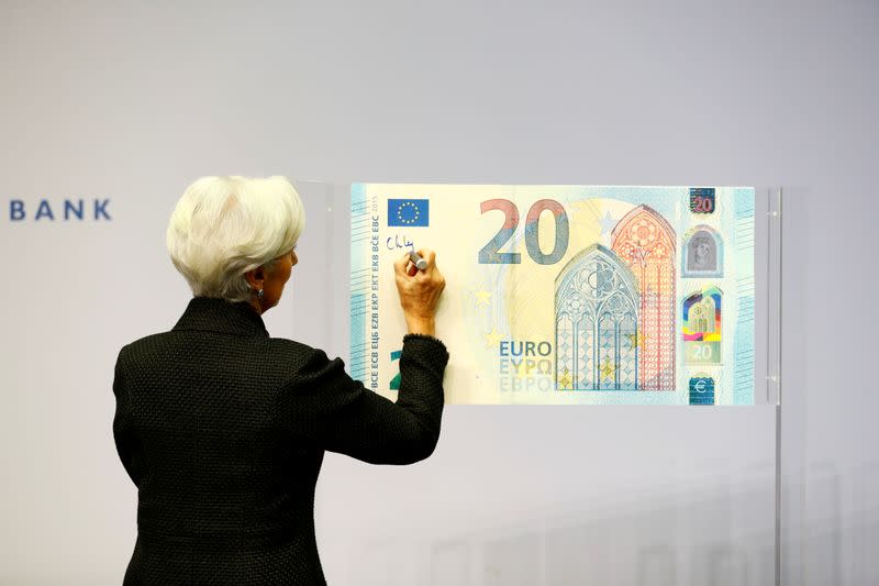 FILE PHOTO: European Central Bank (ECB) President Lagarde gives a signature for newly printed euro banknotes in Frankfurt