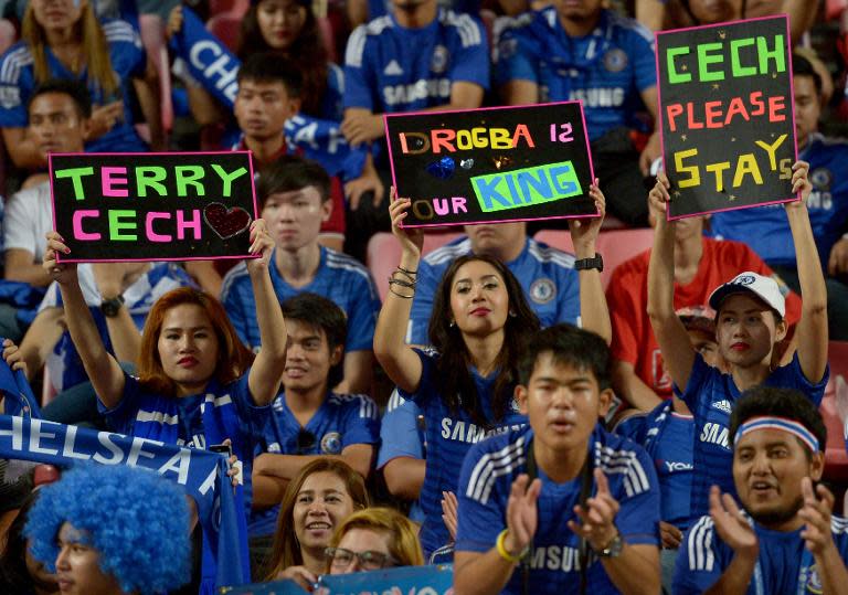 Chelsea football fans cheer the team during the friendly match against Thailand All-Stars in Bangkok on May 30, 2015