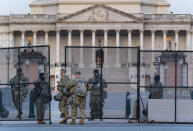 National Guard troops keep watch at the Capitol in Washington, early Thursday, March 4, 2021, amid intelligence warnings that there is a "possible plot" by a group of militia extremists to take control of the Capitol on March 4 to remove Democrats from power. The threat comes nearly two months after thousands of supporters of then-President Donald Trump stormed the Capitol in a violent insurrection as Congress was voting to certify Joe Biden's electoral win. (AP Photo/J. Scott Applewhite)