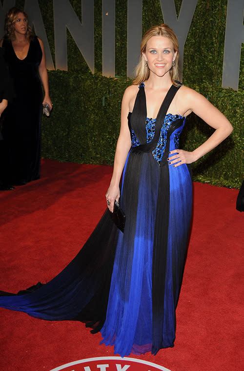 Reese looks stunning in a blue and black floor-length gown. It's definitely not white and gold. We think.