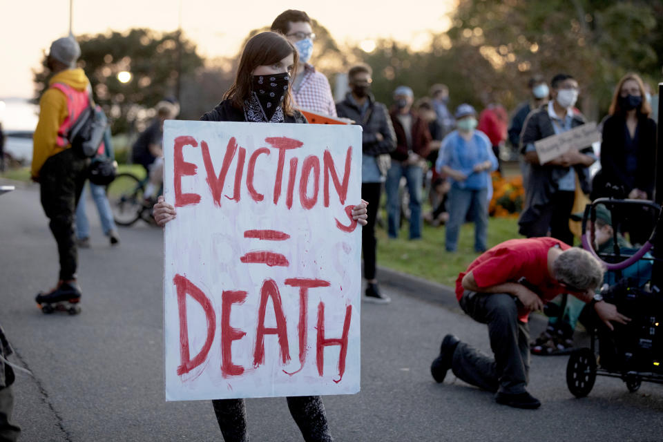 Housing activists gather in front of Gov. Charlie Baker's house on Oct. 14, 2020, in Swampscott, Mass. (Michael Dwyer / AP file)
