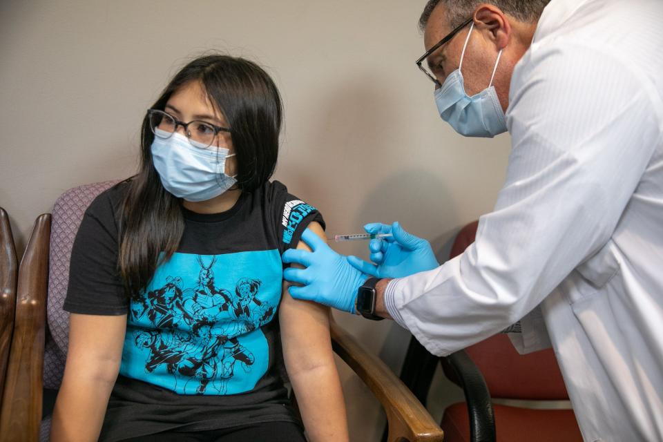 Zoe Chocallo, 11, receives her first dose of the COVID-19 vaccine from Dr. Jeffrey Horowitz in Warwick, NY, on Wednesday, Nov. 17, 2021.