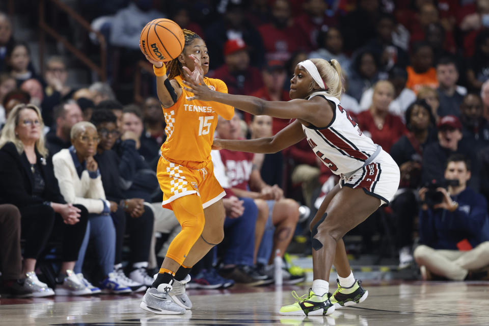 Tennessee guard Jasmine Powell (15) passes around South Carolina guard Raven Johnson during the first half of an NCAA college basketball game in Columbia, S.C., Sunday, March 3, 2024. (AP Photo/Nell Redmond)