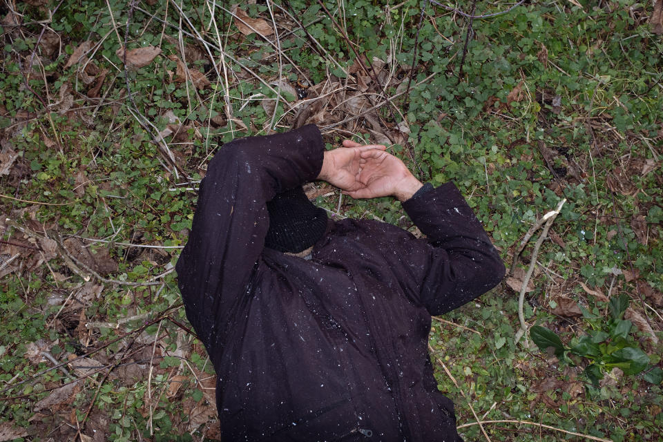 A man sleeps on the ground. | Emin Ozmen—Magnum Photos for TIME