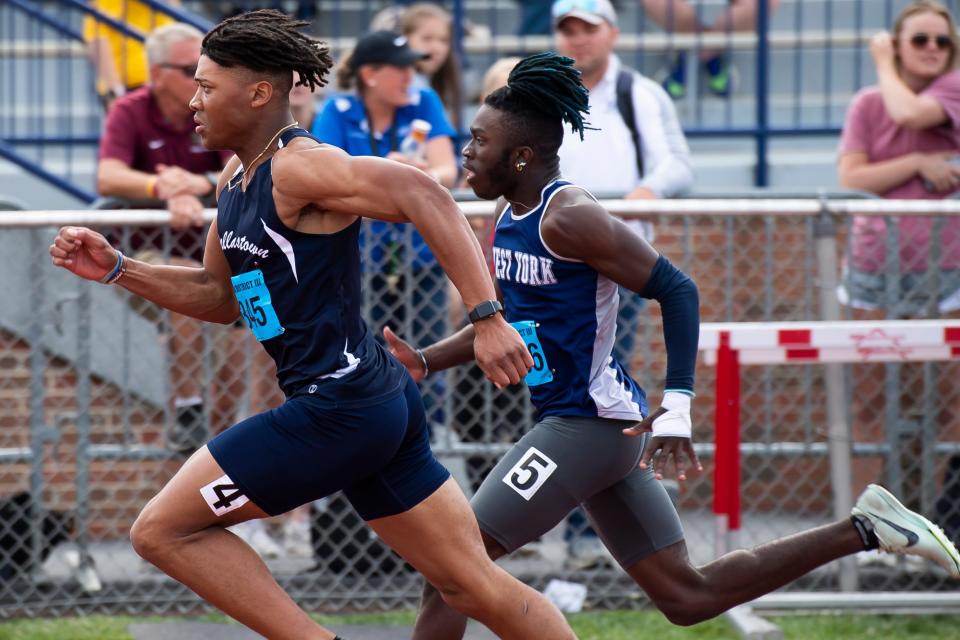 Dallastown's Kenny Johnson (left) and West York Nico Wright-Phillips compete in the 3A 200-meter dash semifinals at the PIAA District 3 Track and Field Championships at Shippensburg University Friday, May 19, 2023.