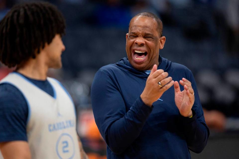 North Carolina coach Hubert Davis jokes around with Elliot Cadeau (2) during their practice on Wednesday, March 20, 2024 as they prepare for the NCAA Tournament at Spectrum Center in Charlotte, N.C.