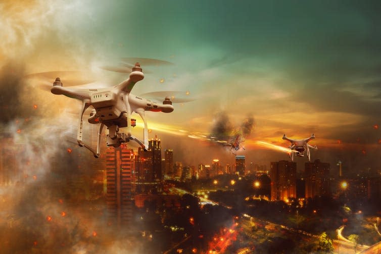 <span class="caption">A ‘killer’ drone concept image.</span> <span class="attribution"><a class="link " href="https://www.shutterstock.com/image-photo/drones-battle-over-city-night-time-387556747?src=LpdTX4-E5-tBVcUFNBMJow-1-4" rel="nofollow noopener" target="_blank" data-ylk="slk:Shutterstock/leolintang;elm:context_link;itc:0;sec:content-canvas">Shutterstock/leolintang</a></span>