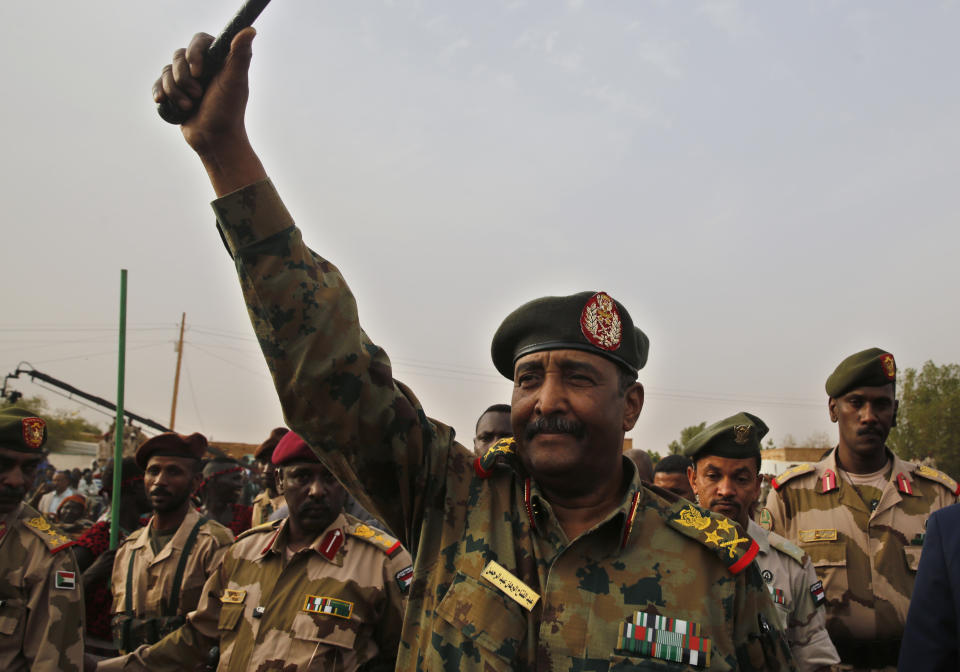 FILE - In this June 29, 2019 file photo, Sudanese Gen. Abdel-Fattah Burhan, head of the military council, waves to his supporters upon his arrival to attend a military-backed rally, in Omdurman district, west of Khartoum, Sudan. On Wednesday, Aug. 21, 2019, Burhan was sworn in as the leader of a joint military-civilian body, which is to run the country for a little over three years until elections can be held. The official SUNA news agency says Gen. Abdel-Fattah Burhan was sworn in before the country's top judge. (AP Photo/Hussein Malla, File)