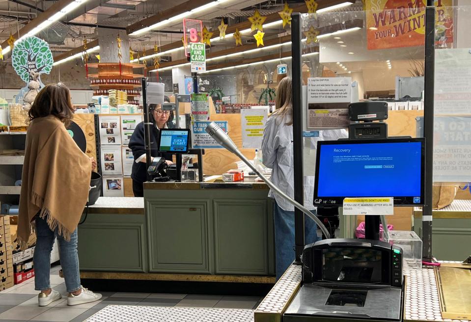 A cash register shows a blue screen at a grocery store affected by a cyber outage in Sydney, Australia July 19, 2024.