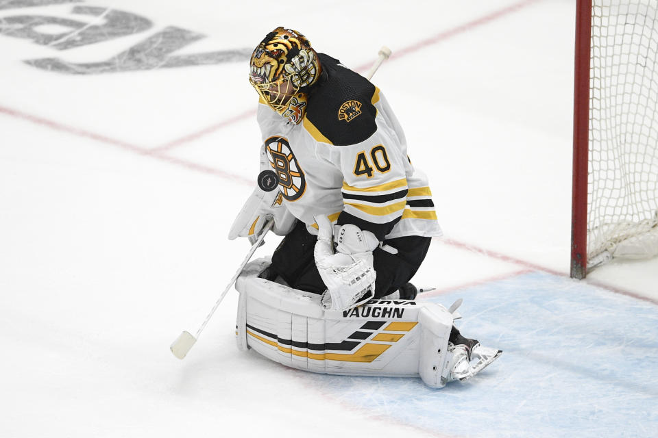 Boston Bruins goaltender Tuukka Rask stops the puck during the second period in Game 5 of an NHL hockey Stanley Cup first-round playoff series against the Washington Capitals, Sunday, May 23, 2021, in Washington. (AP Photo/Nick Wass)