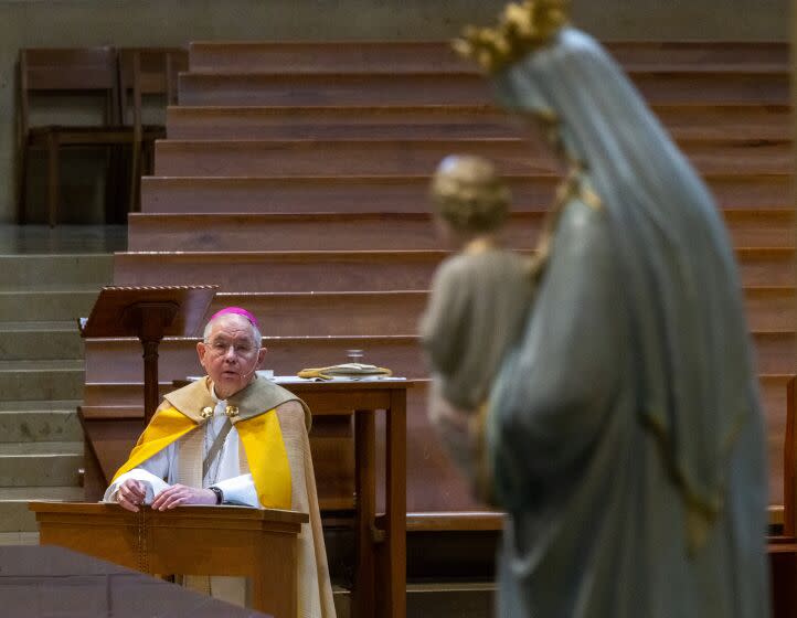 f FILE - In this May 1, 2020, file photo, Archbishop Jose H. Gomez leads a livesteam service at an empty Cathedral of Our Lady of the Angels in Los Angeles. In a May 22, 2021 memo, Gomez confirmed that the issue of whether or not to press ahead with an initiative that could — at least implicitly - rebuke President Joe Biden for receiving Communion while supporting abortion rights, would be on the national meeting's agenda. (AP Photo/Damian Dovarganes, Pool, File)