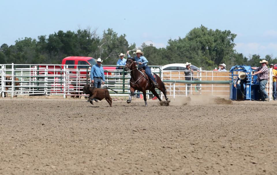 Faith Fliehs attempts to rope a calf during a breakaway event at the Hub 4H Rodeo at Akkerman Arena in Aberdeen on July 2, 2022.