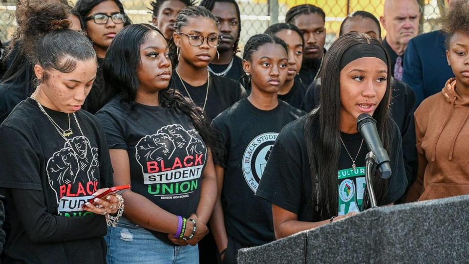 Edison High School Black Student Union representative Simone Alford, right, addresses reporters on May 9, 2022, after hundreds of students walked out of class to protest persistent online bullying of Black students in Fresno during the school year. Tensions came to a head after a racist photo taken in the Bullard High weight room appeared online. Many Black students said the incident was just the latest chapter in a decades-long pattern of systemic discrimination in city schools. FUSD says the African American Academic Acceleration Department is dedicated to ending the achievement gap experienced by Black students and changing the district’s culture. (Bee file photo)