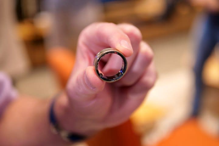 A person holding the Samsung Galaxy Ring.