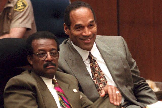 <p>AFP via Getty Images</p> From left: Johnnie Cochran Jr. and O.J. Simpson