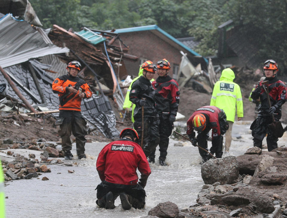 People take part in a search and rescue operation after a landslide caused by torrential rain in Yecheon, South Korea, July 15, 2023. / Credit: YONHAP via REUTERS