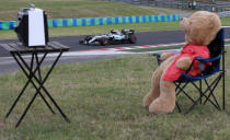 <p>German driver Nico Rosberg steers his Mercedes as teddy bear is placed on a chair during the second practice session for Sunday’s Formula One Hungary Grand Prix, at the Hungaroring racetrack, in Budapest, Hungary, Friday, July 22, 2016. (AP Photo/Luca Bruno)</p>