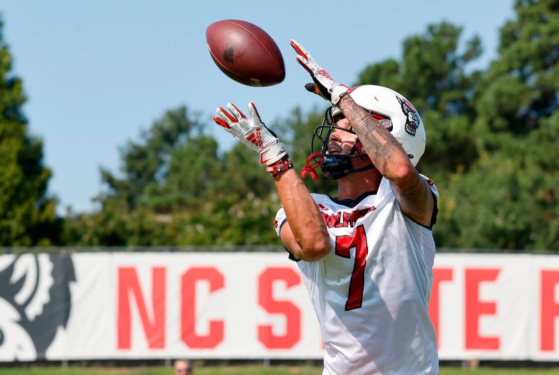 N.C. State wide receiver Anthony Smith (7) pulls in pas during the Wolfpack’s first practice of fall camp in Raleigh, N.C., Wednesday, August 3, 2022.