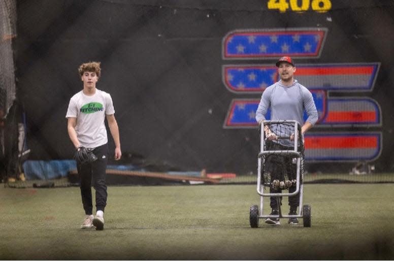 Jeff Singer training one of his pitchers