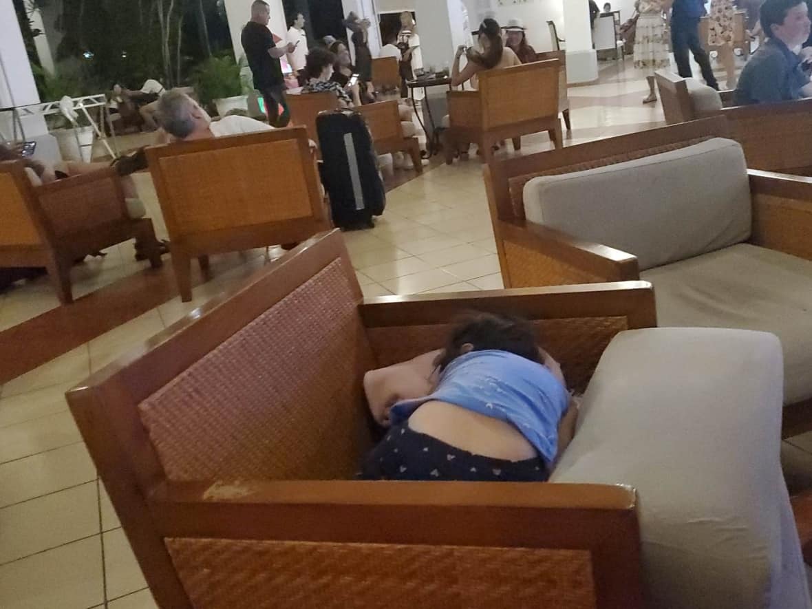 Roice Anne Fox has been waiting in hotel lobbies in Varadero, Cuba, with her family. She says during the endless wait her youngest daughter fell sick to a respiratory illness, which was an added stress, and has to sleep on lobby chairs.  (Submitted by Roice Anne Fox - image credit)