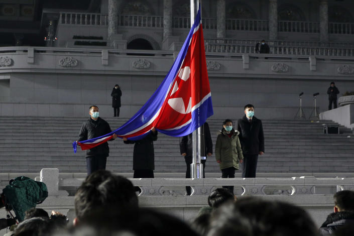 National flag hoisting ceremony is held on Kim Il Sung Square in Pyongyang, North Korea, on New Year's Day Saturday, Jan. 1, 2022. (AP Photo/Cha Song Ho)